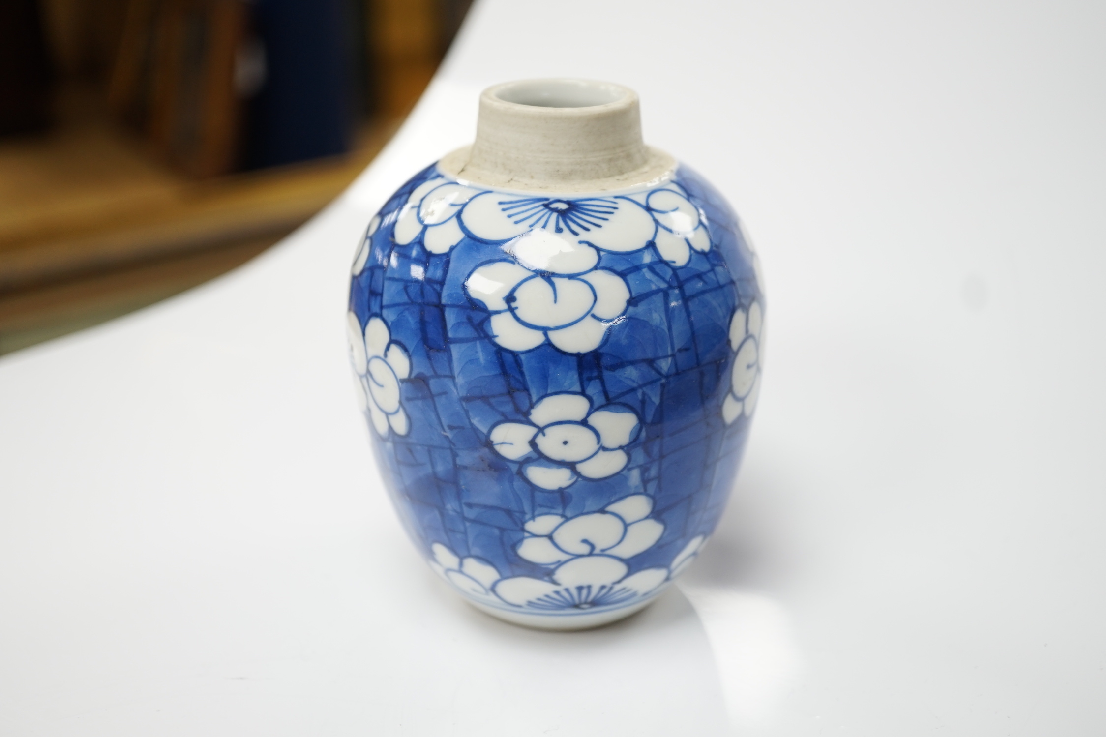 A Chinese Kangxi blue and white ‘prunus’ ovoid jar, 11cm